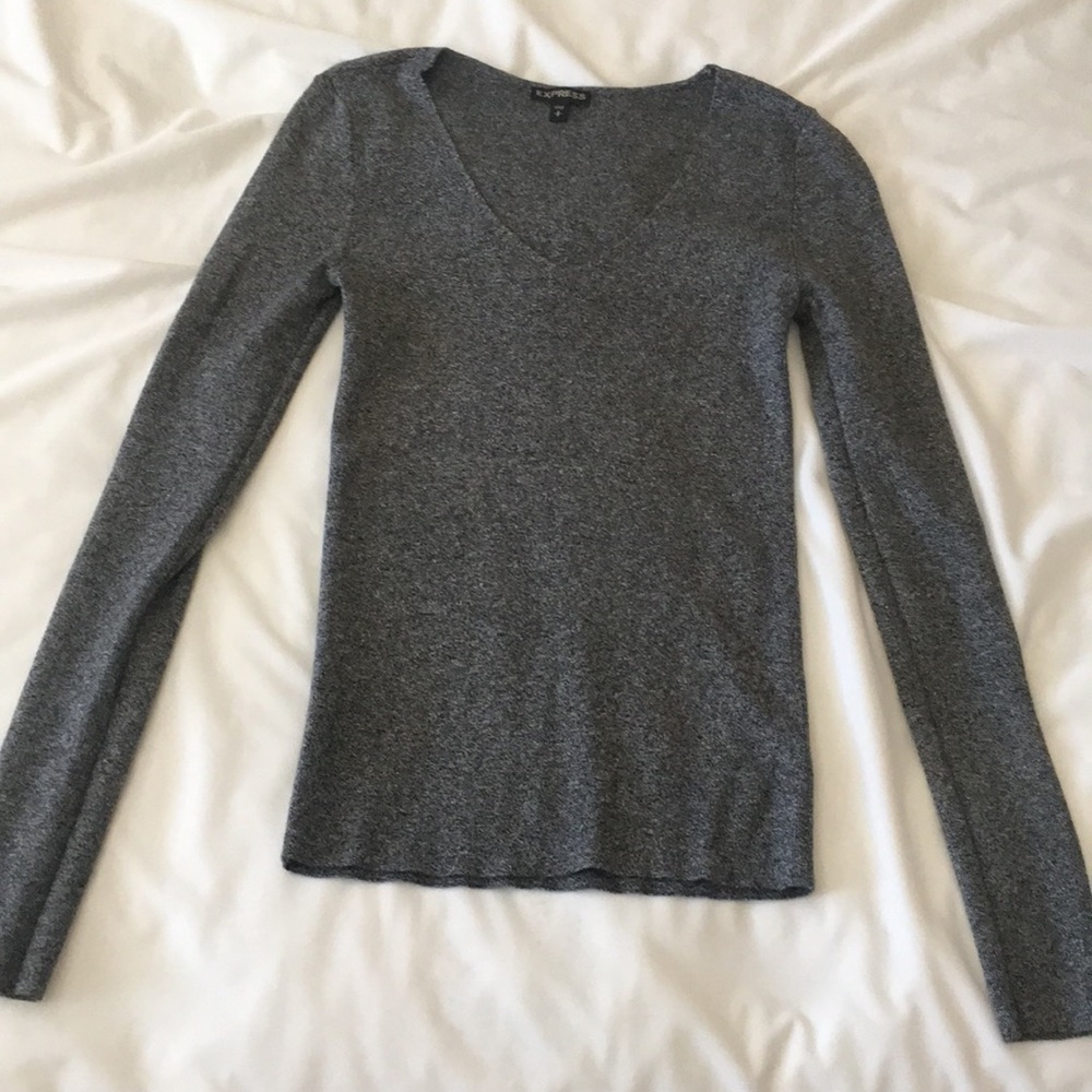 Woman’s grey v neck sweater